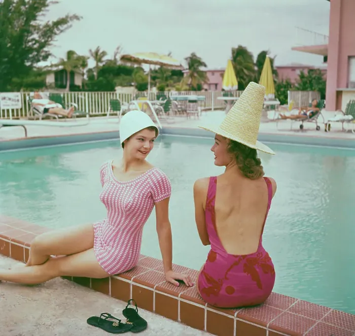 Framed Print : Fashionable Women Lounging at Poolside Framed Print : Fashionable Women Lounging at Poolside