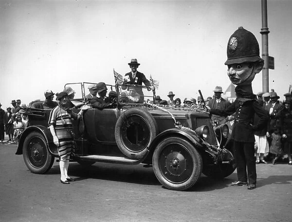 Fat Head. circa 1929: A big-headed policeman at the Rhyl Carnival and Fete