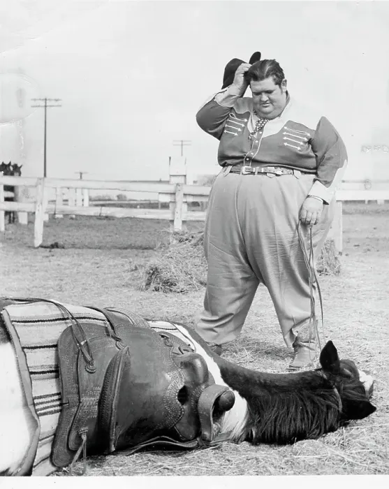 Framed Print : Fat Man Stands Over Fallen Horse