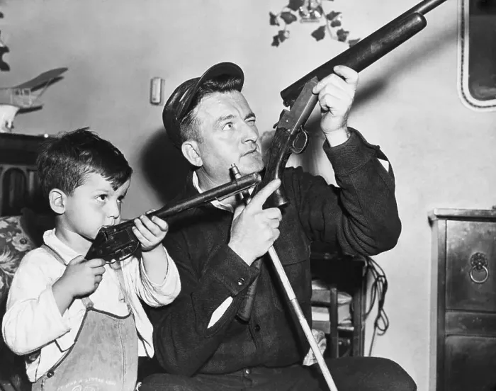 Framed Print : Father Teaching Son About Guns Framed Print : Father Teaching Son About Guns