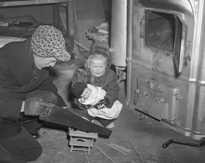 Framed Print : Father Uses Toy High Chair for Fuel During Coal Strike