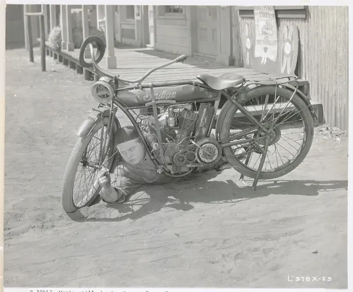Framed Print : Fatty Arbuckle Repairing Motorcycle in Movie Still Framed Print : Fatty Arbuckle Repairing Motorcycle in Movie Still