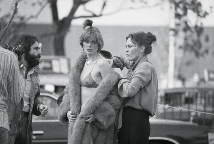 Framed Print : Faye Dunaway Assisting Model with Fur Coat Framed Print : Faye Dunaway Assisting Model with Fur Coat