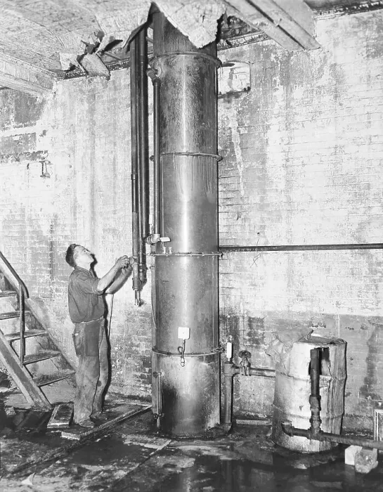 Framed Print : Federal Agent Inspecting Large Illegal Still Framed Print : Federal Agent Inspecting Large Illegal Still