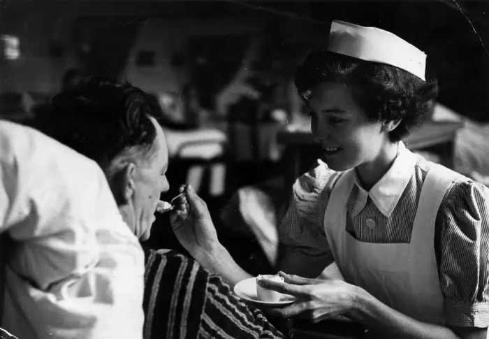Framed Print : Feeding The Patient Framed Print : Feeding The Patient