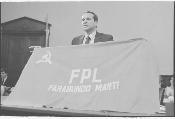 Framed Print : Felix Rodriguez Speaking at Podium with Guerilla Flag Framed Print : Felix Rodriguez Speaking at Podium with Guerilla Flag