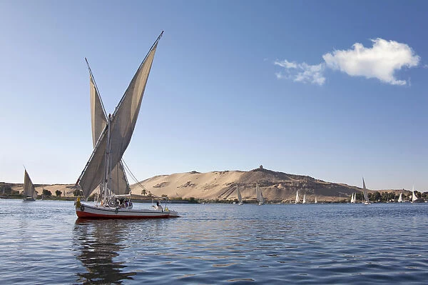 Felucca, a traditional wooden sailing boat, on the Nile, Aswan, Egypt, Africa