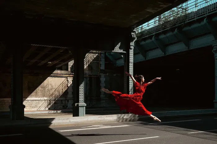 Framed Print : Female ballet dancer dancing with pointes in the street with a long red dress Framed Print : Female ballet dancer dancing with pointes in the street with a long red dress
