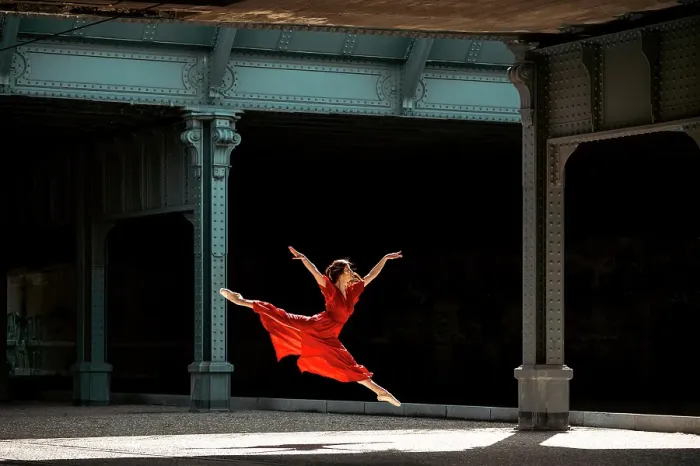 Framed Print : Female ballet dancer dancing with pointes in the street with a long red dress Framed Print : Female ballet dancer dancing with pointes in the street with a long red dress