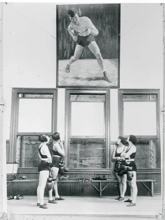 Framed Print : Female Boxers Looking at Portrait of Jack Dempsey Framed Print : Female Boxers Looking at Portrait of Jack Dempsey