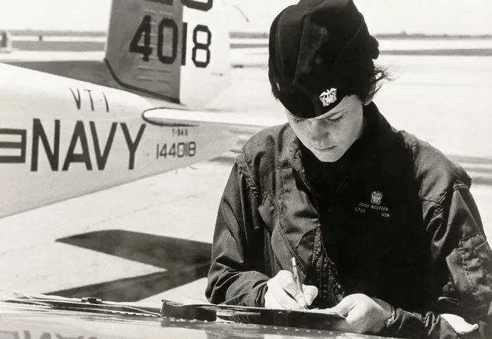 Framed Print : Female Flyer in Front of Plane Framed Print : Female Flyer in Front of Plane