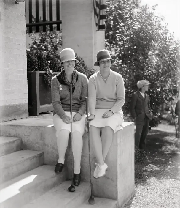 Framed Print : Two female golf players on porch, 1928 Framed Print : Two female golf players on porch, 1928