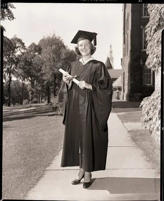 Framed Print : Female Graduate in Cap and Gown with Diploma Framed Print : Female Graduate in Cap and Gown with Diploma