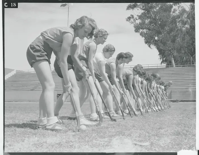 Framed Print : Female Hockey Teammates Practicing Position on Field Framed Print : Female Hockey Teammates Practicing Position on Field