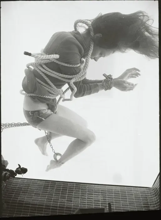 Framed Print : Female Magician Mari Lou Sinking in Water While in Chains Framed Print : Female Magician Mari Lou Sinking in Water While in Chains
