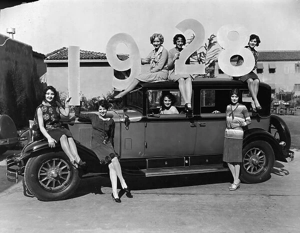 Female Models Pose With 1928 Car