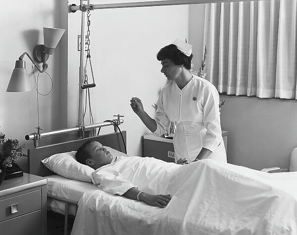 Female nurse checking boy's temperature