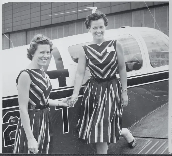 Framed Print : Female Pilots Posing Next to Their Plane Framed Print : Female Pilots Posing Next to Their Plane
