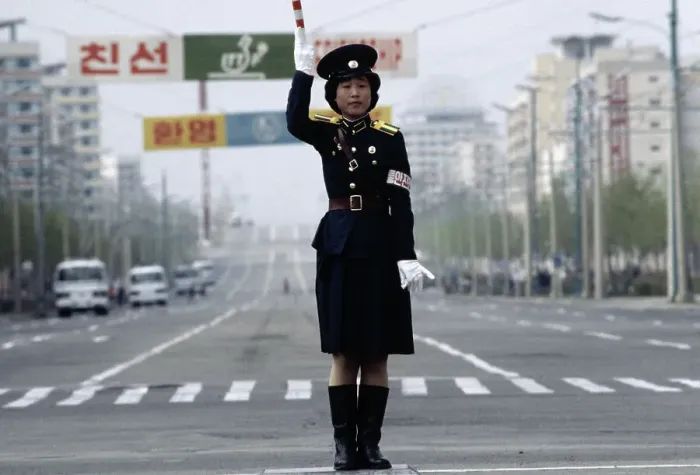 Framed Print : Female Police Officer in Middle of Street Framed Print : Female Police Officer in Middle of Street