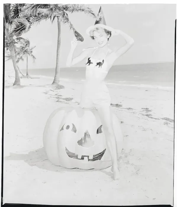 Framed Print : Female Sitting Atop Halloween Pumpkin Framed Print : Female Sitting Atop Halloween Pumpkin