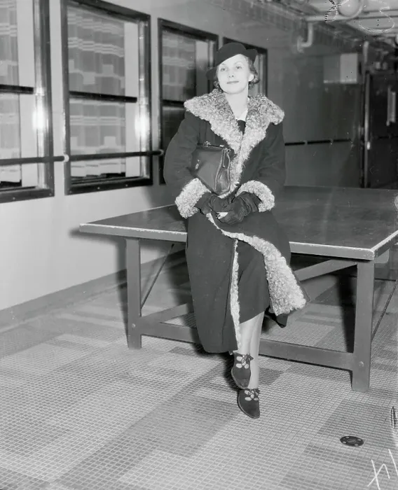 Framed Print : Female Socialite Sitting and Posing on Table Framed Print : Female Socialite Sitting and Posing on Table