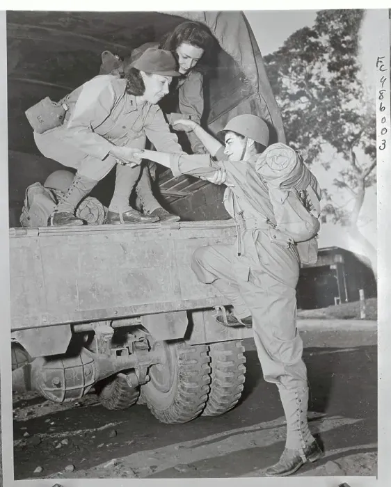 Framed Print : Female Soldier Boarding Truck Framed Print : Female Soldier Boarding Truck