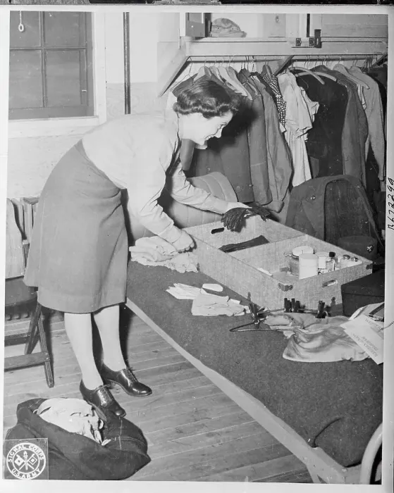 Framed Print : Female Soldier Organizing Her Goods from Luggage Framed Print : Female Soldier Organizing Her Goods from Luggage