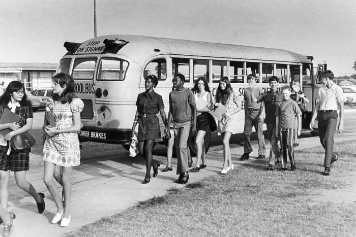 Framed Print : Female Students Walk From Bus To School Framed Print : Female Students Walk From Bus To School