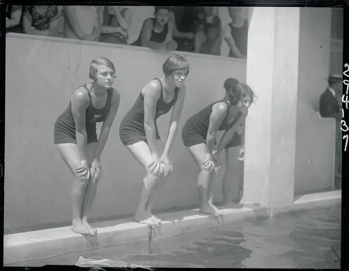 Framed Print : Female Swimmers Preparing to Dive into the Pool Framed Print : Female Swimmers Preparing to Dive into the Pool