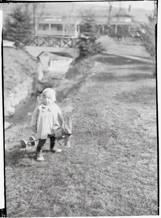 Framed Print : Female Toddler in Park Near Small Bridge Framed Print : Female Toddler in Park Near Small Bridge