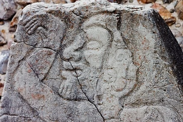 Figure (dancing) on a stone in Monte Alban, Mexico