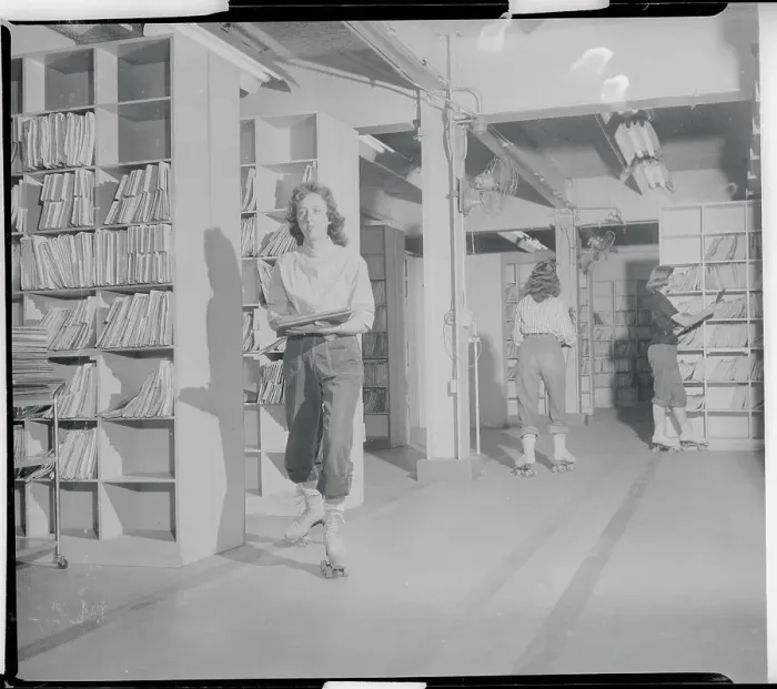 Framed Print : File Clerks Wearing Roller Skates Framed Print : File Clerks Wearing Roller Skates