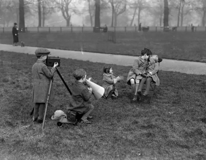 Framed Print : Film Kids. February 1928: Child cinematographers in Hyde Park producing a love scene Framed Print : Film Kids. February 1928: Child cinematographers in Hyde Park producing a love scene