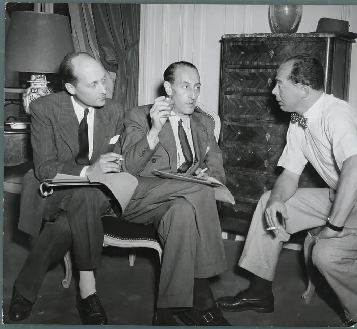 Framed Print : Film Producer Billy Wilder and Associates Conversing Framed Print : Film Producer Billy Wilder and Associates Conversing