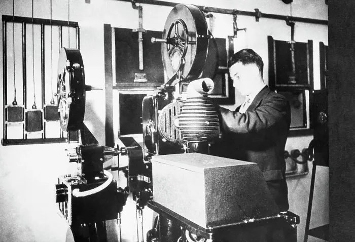 Framed Print : Film Projector and Technician Framed Print : Film Projector and Technician