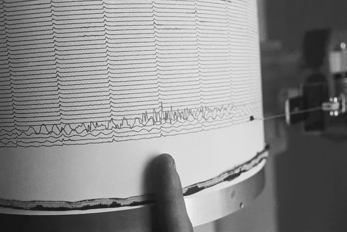 Framed Print : Finger Pointing to Earthquake Reading on Seismograph Framed Print : Finger Pointing to Earthquake Reading on Seismograph
