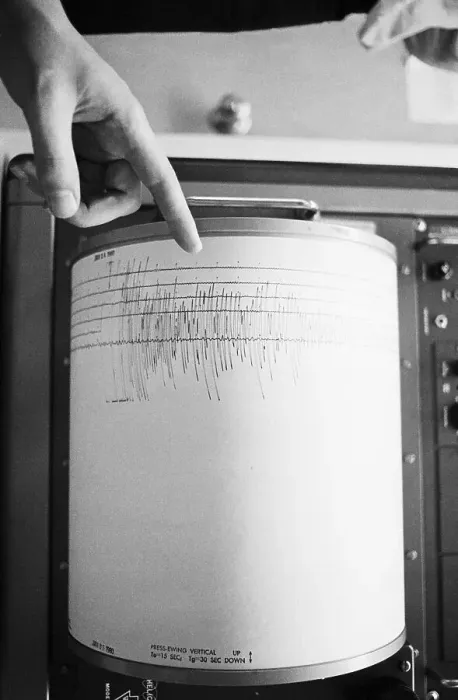 Framed Print : Finger Pointing To Seismograph Reading Framed Print : Finger Pointing To Seismograph Reading
