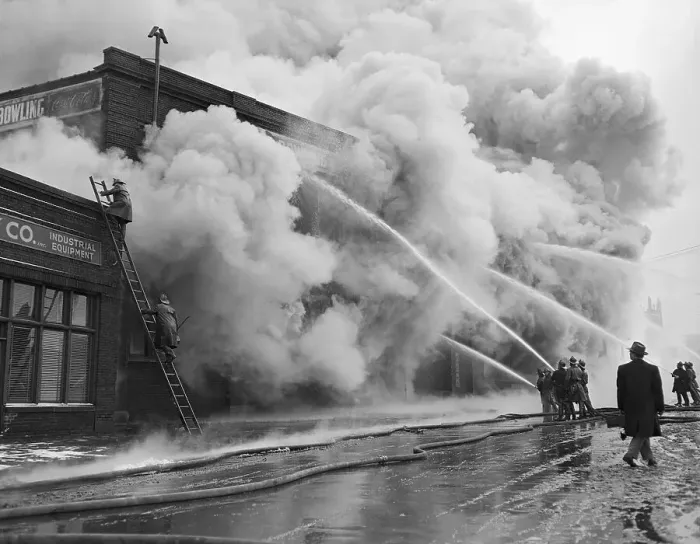 Framed Print : Firefighters Spraying Brick Building