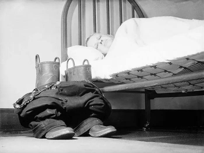 Framed Print : Fireman Sleeping with His Cloths Nearby