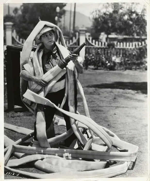 Framed Print : Fireman Tangled up by a Hose Framed Print : Fireman Tangled up by a Hose