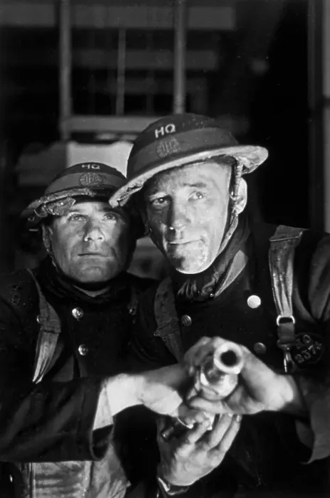 Framed Print : Firemen. 1st February 1941: Two firemen prepare to aim a hose at a blaze Framed Print : Firemen. 1st February 1941: Two firemen prepare to aim a hose at a blaze