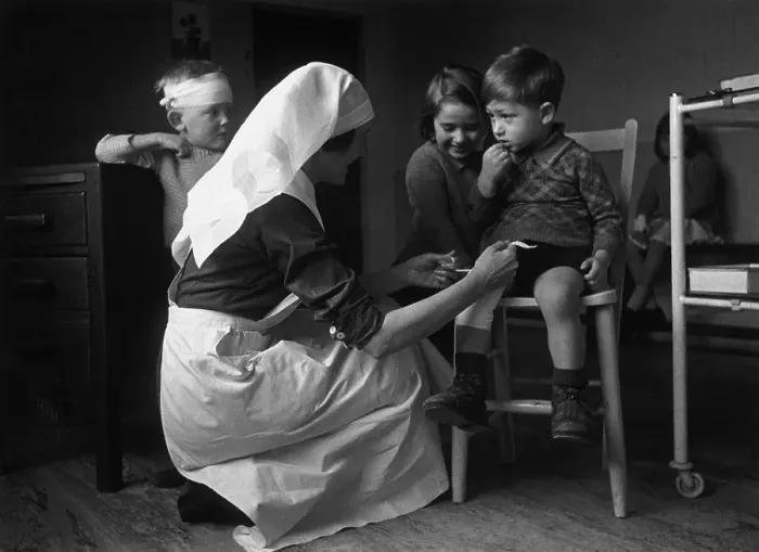 Framed Print : First Aid. 29th July 1944: A children's nurse at a clinic at East Finchley