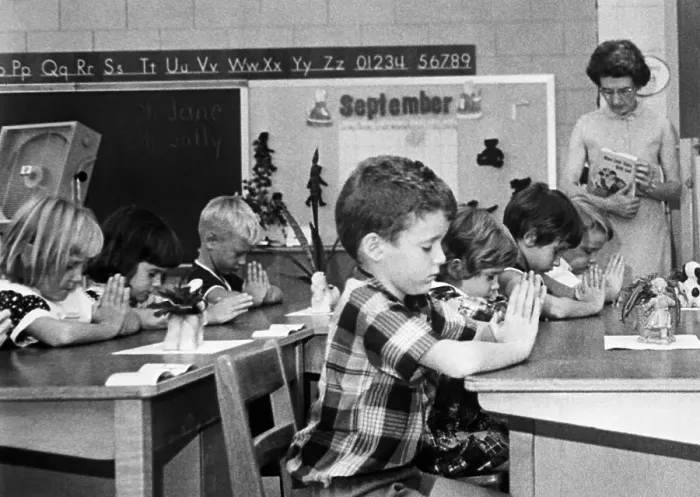 Framed Print : First Graders Pray in Classroom