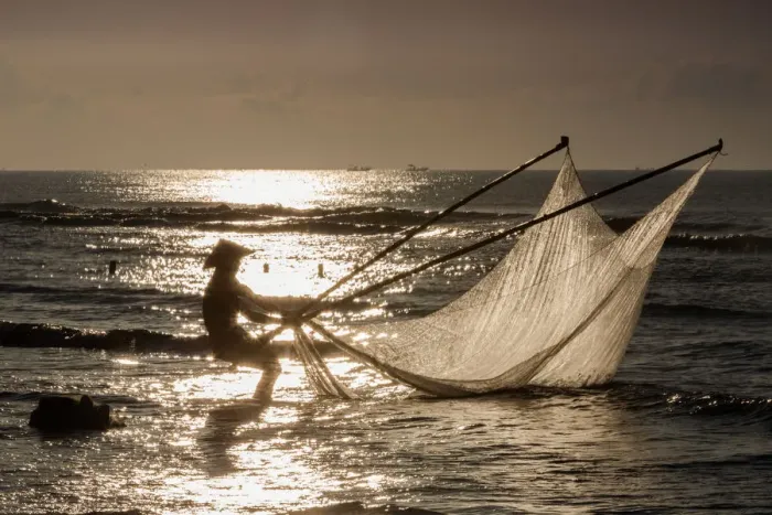 Framed Print : One fisherman on the beach, dawn, Vietnam Framed Print : One fisherman on the beach, dawn, Vietnam