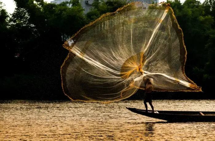 Framed Print : Fisherman catch fish in the river in Hue, Vietnam Framed Print : Fisherman catch fish in the river in Hue, Vietnam