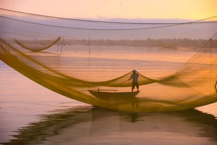Framed Print : One fisherman with fishing net system, Hoi An ancient town, Vietnam