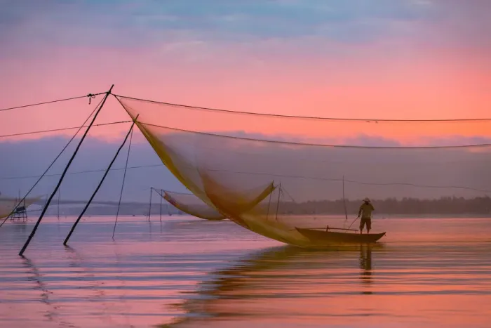 Framed Print : One fisherman with fishing net system, Hoi An ancient town, Vietnam