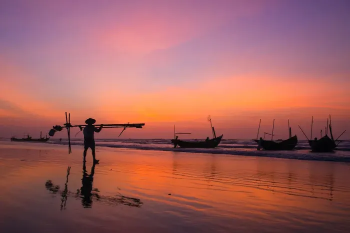 Framed Print : Fisherman going on the beach at dawn in Vietnam Framed Print : Fisherman going on the beach at dawn in Vietnam