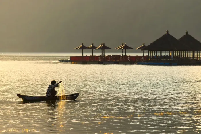 Framed Print : A fisherman on lake Batur, Bali, Indonesia Framed Print : A fisherman on lake Batur, Bali, Indonesia