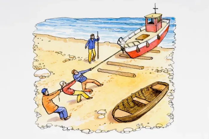 Framed Print : Fisherman pulling trawler onto beach Framed Print : Fisherman pulling trawler onto beach